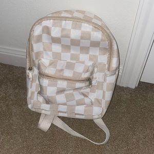 checked mini back pack. Great for carrying small stuff.